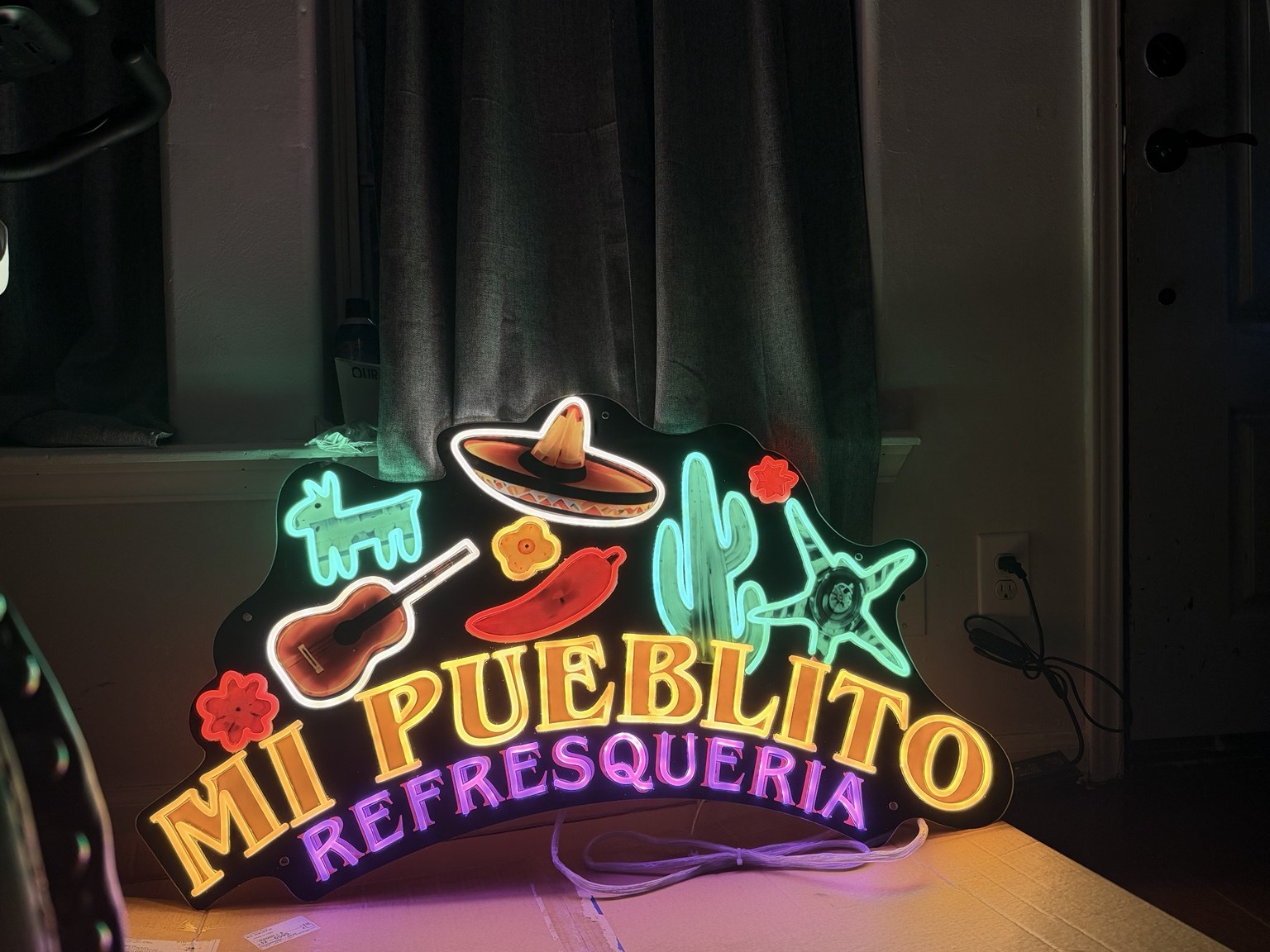 Mi Pueblito Refresquería logo sign.